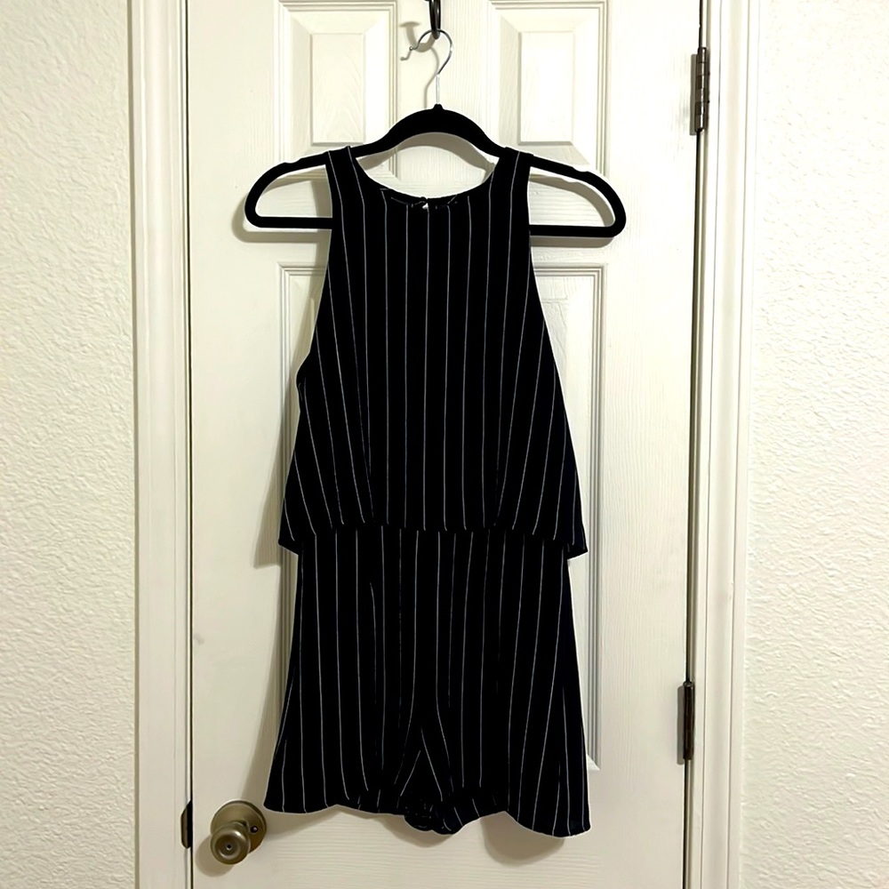 NWT-classy black and white striped romper with a tad open back.